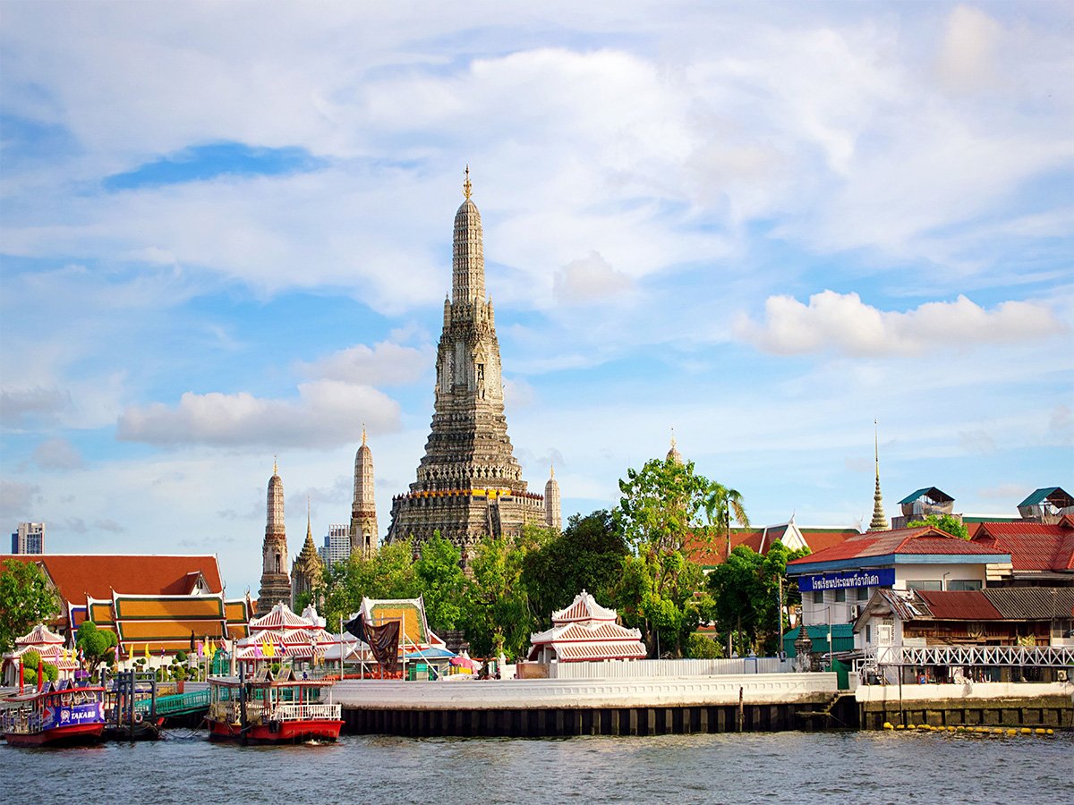 Wat Arun temple beside the Chao Phraya River in Bangkok, Thailand