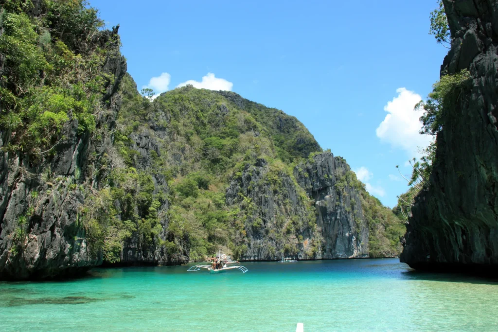 Clear turquoise water and limestone cliffs at Big Lagoon in El Nido