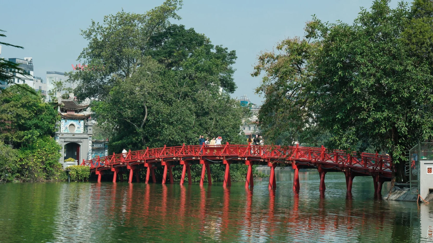 The Huc red bridge crossing Hoan Kiem Lake in Hanoi