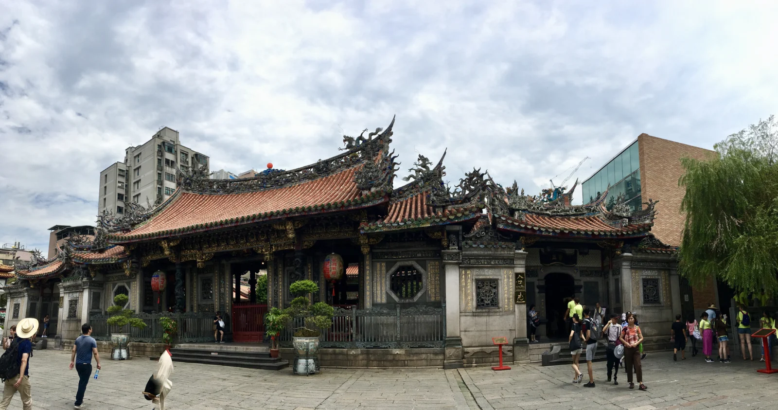 Traditional tiled roofs and courtyard of Longshan Temple in Taipei
